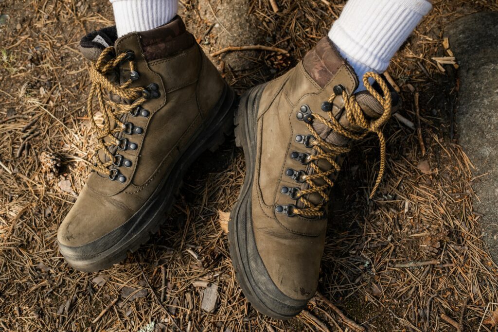 Choosing hiking boots like this brown pair is a must for your adventures.
